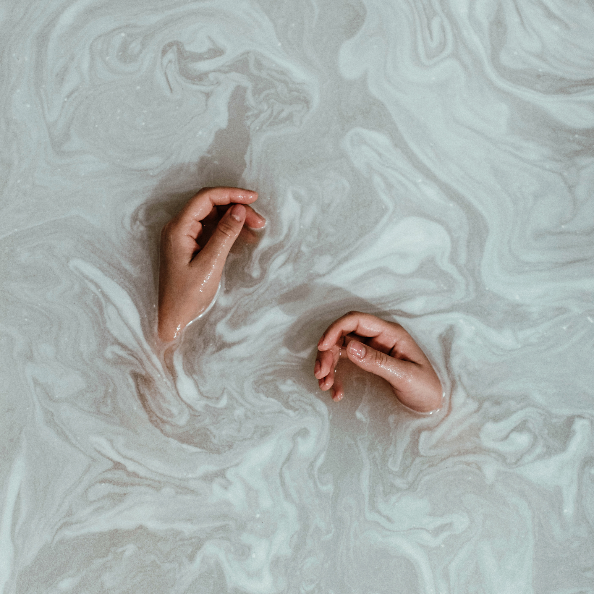 Person's Hands In The Water
